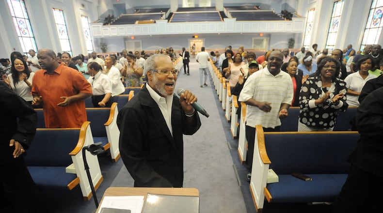 Minster Thomas Taylor sings as Hopewell Missionary Baptist Church holds a town hall meeting against gay marriage in Norcross, Friday, June 26, 2015. In a 5-4 ruling, the U.S. Supreme Court ruled Friday that the Constitution requires states to license same-sex marriage and to recognize same-sex marriages lawfully performed elsewhere. KENT D. JOHNSON /KDJOHNSON@AJC.COM