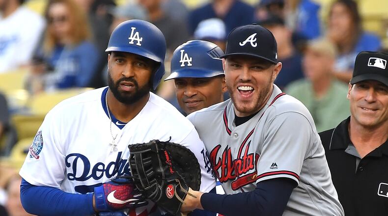 Freddie Freeman greets former teammate Matt Kemp in signature Freddie fashion.