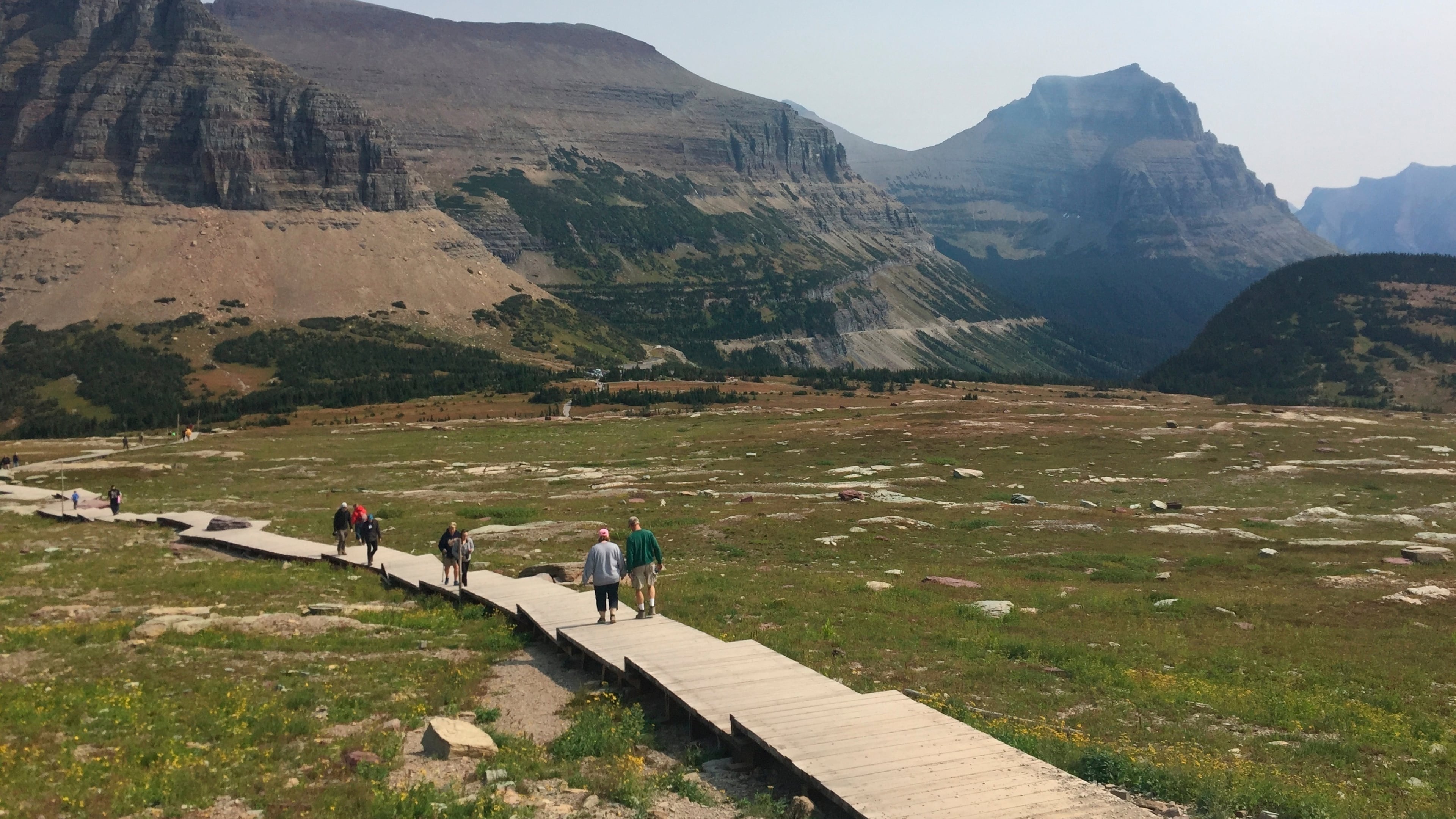 File - People hike at Glacier National Park in Montana. (AP Photo/Beth J. Harpaz, File)
