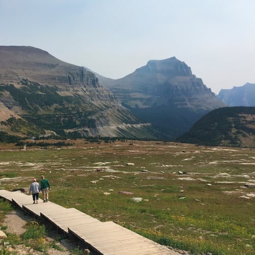 File - People hike at Glacier National Park in Montana. (AP Photo/Beth J. Harpaz, File)