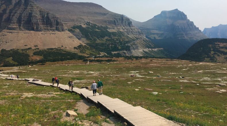 File - People hike at Glacier National Park in Montana. (AP Photo/Beth J. Harpaz, File)