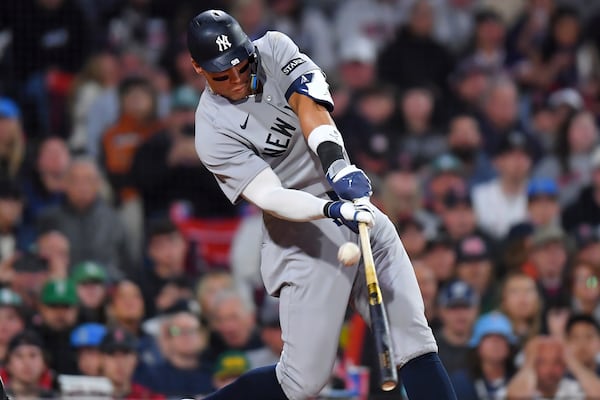 New York Yankees' Aaron Judge strikes out swinging in the eighth inning of a baseball game against the Boston Red Sox, Saturday, June 14, 2025, in Boston. (AP Photo/Steven Senne)