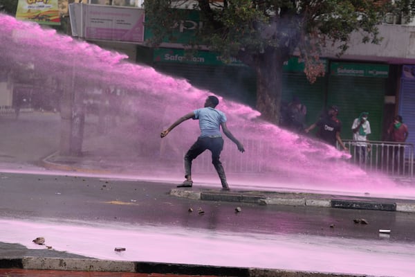 People protest for the one-year anniversary of deadly anti-tax demonstrations in Nairobi, Kenya, Wednesday, June 25, 2025. (AP Photo/Brian Inganga)