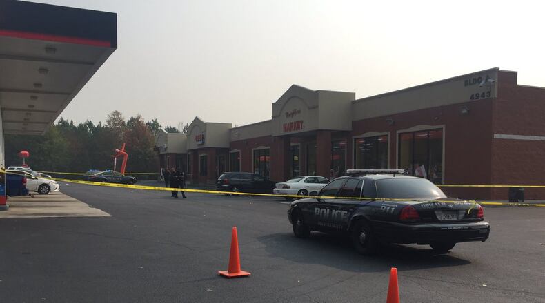 Two people were shot outside a cellphone store in DeKalb County on Monday. (Credit: Channel 2 Action News)