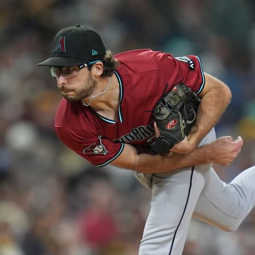 FILE - Arizona Diamondbacks starting pitcher Zac Gallen works against a San Diego Padres batter during the third inning of a baseball game Friday, Sept. 26, 2025, in San Diego. (AP Photo/Gregory Bull,File)