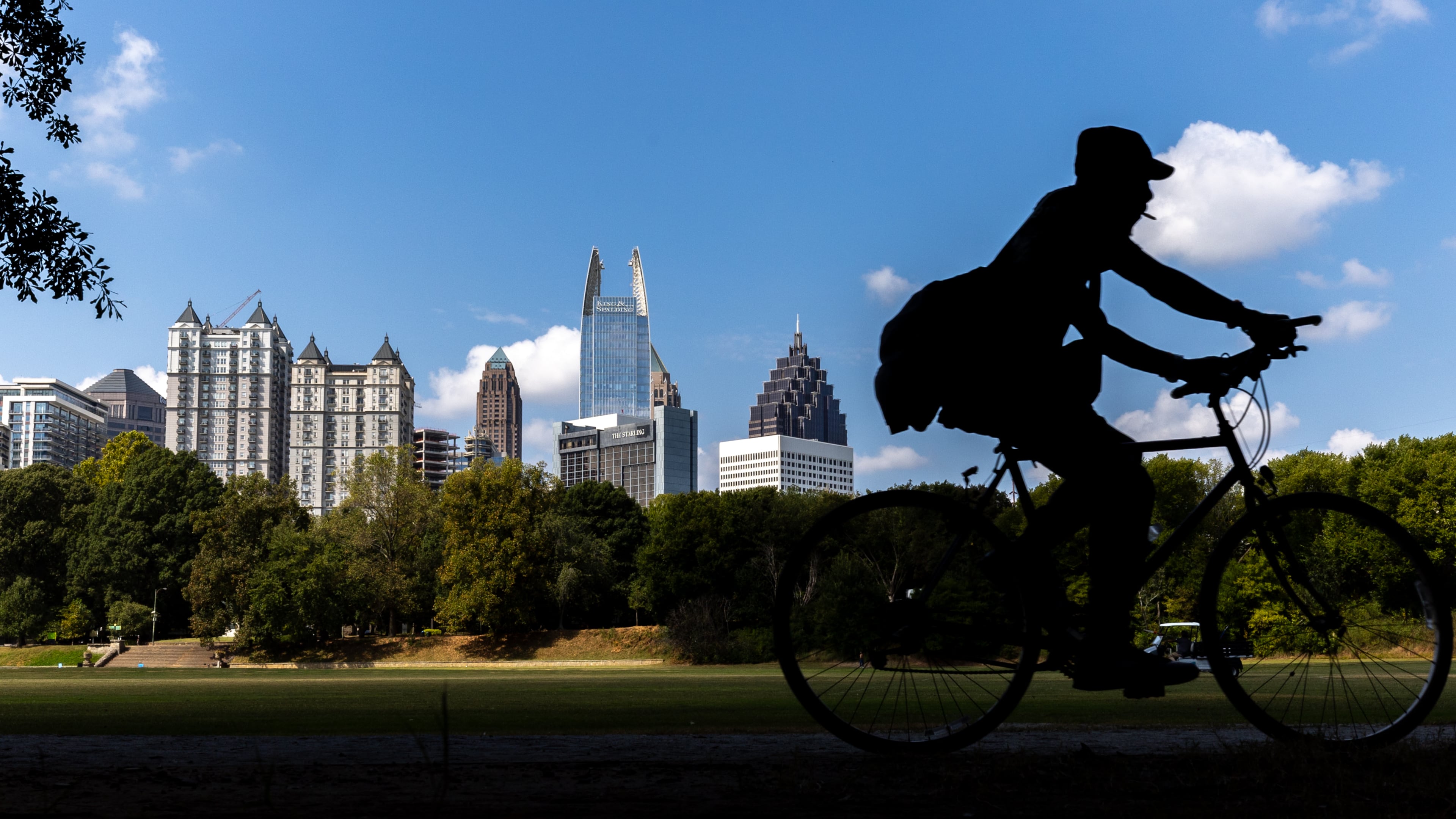 A bicyclist rides through Piedmont Park in Atlanta on Monday, September 22, 2025, the first day of fall. (Arvin Temkar / AJC)