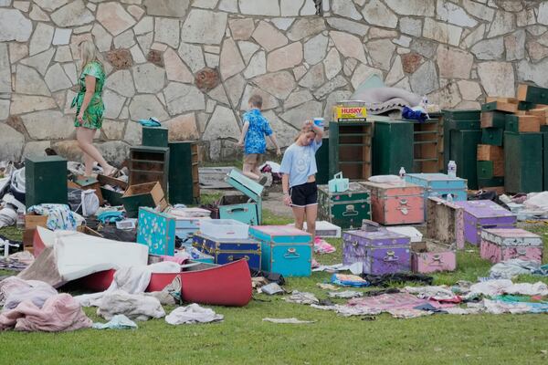 People come to pick up items at Camp Mystic in Hunt, Texas on Wednesday, July 9, 2025. (AP Photo/Ashley Landis)