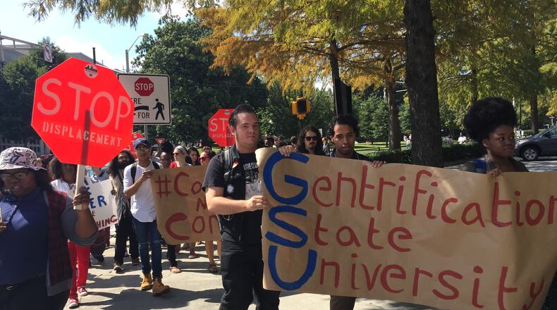 Georgia State University students and residents of neighborhoods near Turner Field stage a march on Tuesday to the downtown school’s Centennial Hall. They sought to meet GSU president Mark Becker to demand a seat at the table in discussions about redeveloping the area around the former home of the Atlanta Braves. LEON STAFFORD/ LSTAFFORD@AJC.COM