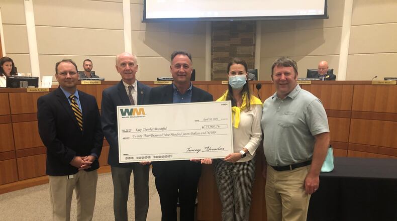 Waste Management donated more than $20,000 to the Keep Cherokee Beautiful program recently. CONTRIBUTED