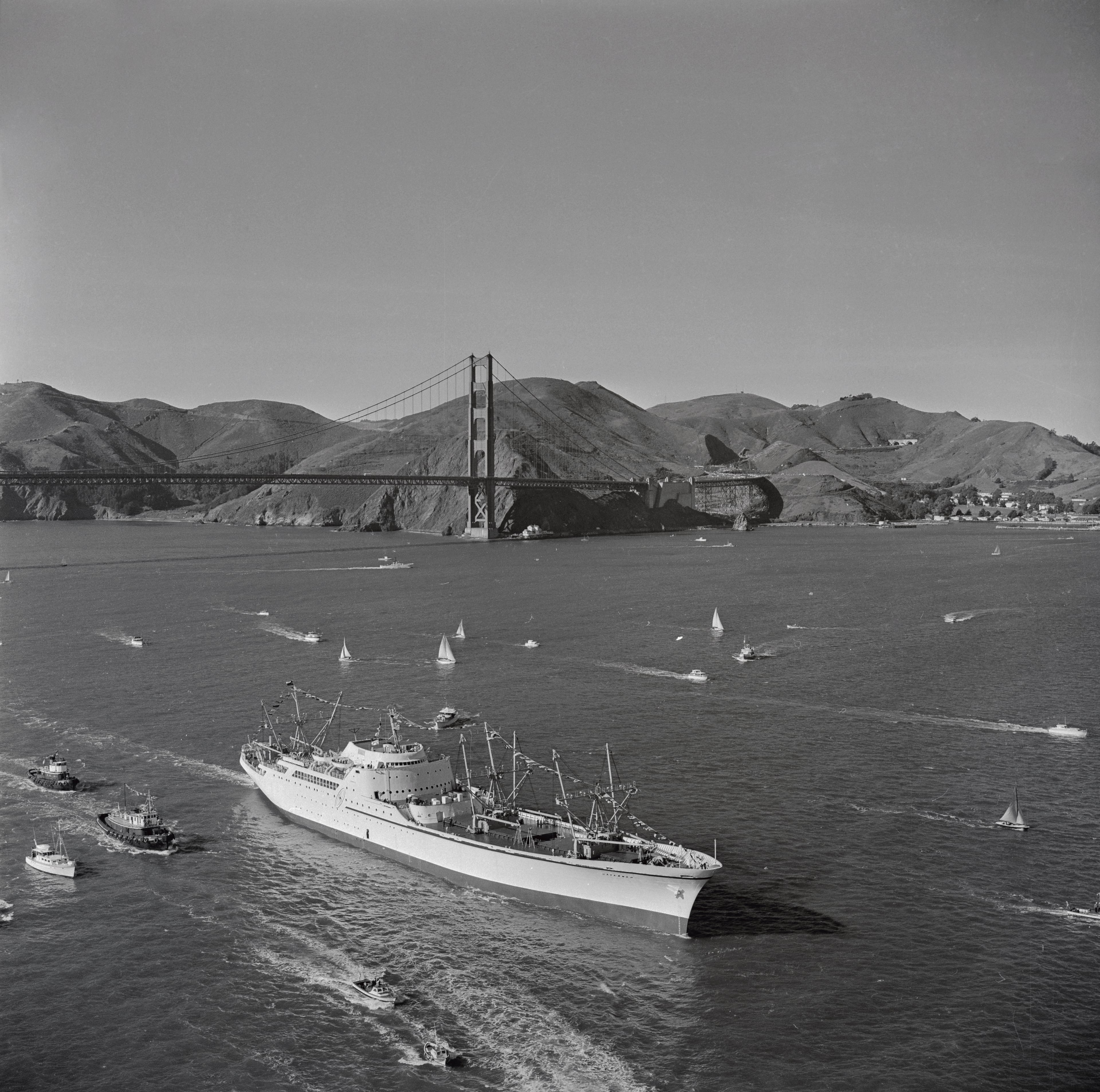 The NS Savannah is escorted by pleasure craft upon arriving in San Francisco for an eight-day visit on Nov. 18, 1959, several months after the nuclear-powered merchant ship launched out of New Jersey. (Bettman Archives via Getty Images)