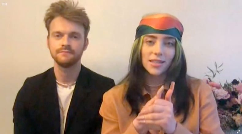 In this screengrab released on March 14, Finneas O'Connell (left) and Billie Eilish accept the Best Song Written for Visual Media award for ‘No Time to Die’ at the 63rd Annual Grammy Awards Premiere Ceremony broadcast on March 14, 2021. (Photo by Rich Fury/Getty Images for The Recording Academy; used with permission of The Recording Academy)