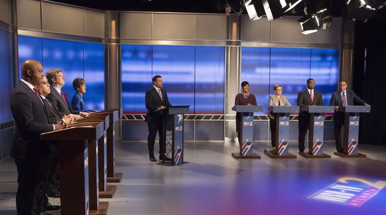 Eight of the top candidates for mayor sparred Sunday at a debate held by WSB-TV. The candidates on the left side are: Councilman Kwanza Hall, former state Sen. Vincent Fort, former city Chief Operating Officer Peter Aman, City Councilwoman Mary Norwood. The candidates from right to center are: former Fulton County Commission Chairman John Eaves, City Council President Ceasar Mitchell, former Council President Cathy Woolard and City Councilwoman Keisha Lance Bottoms. Channel 2 Action News Anchor Justin Farmer moderated. Photo by Phil Skinner