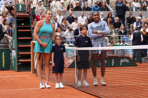 Aryna Sabalenka of Belarus, left, and Coco Gauff of the U.S. pose for a picture before their final match of the French Tennis Open at the Roland-Garros stadium in Paris, Saturday, June 7, 2025. (AP Photo/Aurelien Morissard)