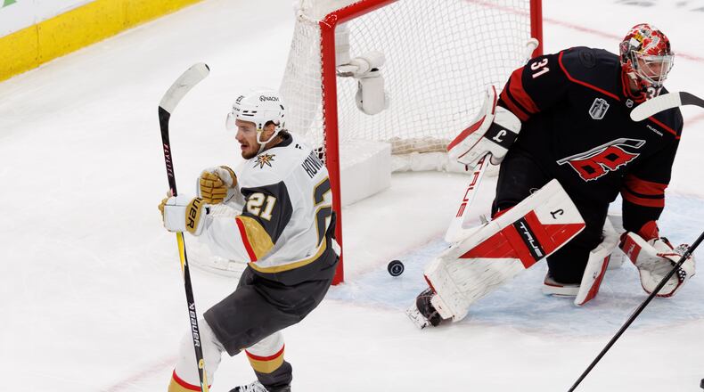 Vegas Golden Knights' Brett Howden (21) reacts ahead of Carolina Hurricanes' goaltender Frederik Andersen (31) after scoring a goal during the first period of Game 2 of the NHL hockey Stanley Cup Final series in Raleigh, N.C., Thursday, June 4, 2026. (AP Photo/Ben McKeown)