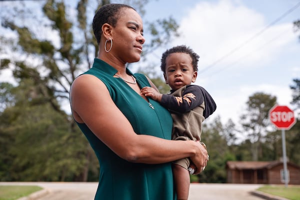 Louisville's Jessica Lewis ― pictured with her 11-month-old-son, Desmond ― said the 50-minute drives to get prenatal and postnatal care were sometimes tiresome, for both her and her son. Sometimes the doctor visit lasts only 5 to 10 minutes, and they then have to get right back in the car for another 50-minute drive home. (Natrice Miller/AJC)
