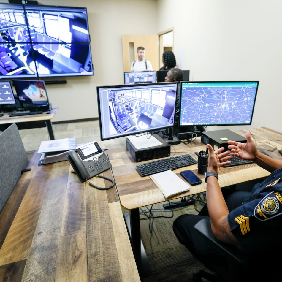 Sgt. Demetrius Garmon with MARTA police explains how he monitors activities on MARTA buses using a real-time system that operates multiple cameras from one of the operation centers at the Emergency Communication Center on Thursday, May 1, 2025. (Miguel Martinez/AJC)