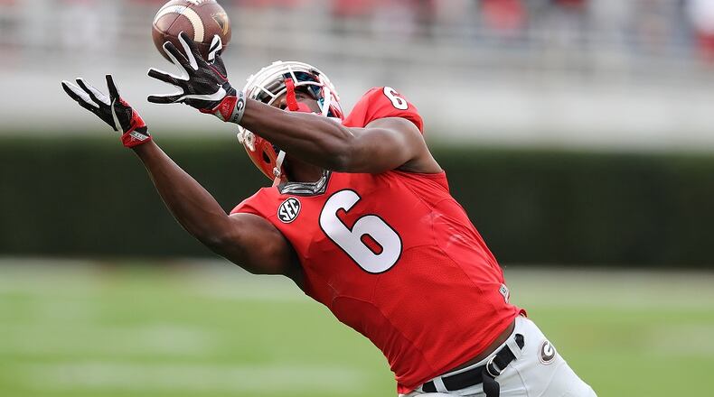 November 12, 2016, Athens: Georgia wide receiver Javon Wims catches a long pass against Auburn during the first quarter that was negated by a Georgia penalty in an NCAA college football game on Saturday, Nov. 12, 2016, in Athens. Curtis Compton/ccompton@ajc.com