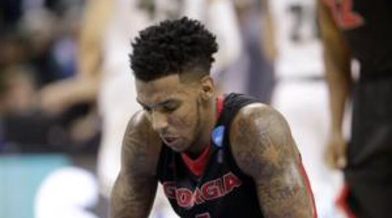 Georgia’s Charles Mann did his best to bring the Bulldogs back from a 13-point deficit against Michigan State. They got to within two, but never ran down Spartans. (AP photo by Nell Redmond)