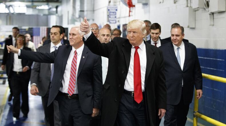 President-elect Donald Trump and Vice President-elect Mike Pence wave as they visit to Carrier factory, in Indianapolis, Ind. Trump is slamming a union leader who criticized his deal to discourage air conditioner manufacturer Carrier Corp. from closing an Indiana factory and moving its jobs to Mexico. Trump tweeted Wednesday evening, Dec. 7, 2016: "Chuck Jones, who is President of United Steelworkers 1999, has done a terrible job representing workers." (AP Photo/Evan Vucci, File)