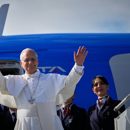 Pope Leo XIV waves as he boards a flight back to the Vatican after his visit to Lebanon at Beirut International Airport in Beirut, Lebanon, Tuesday, Dec. 2, 2025. (AP Photo/Hussein Malla)