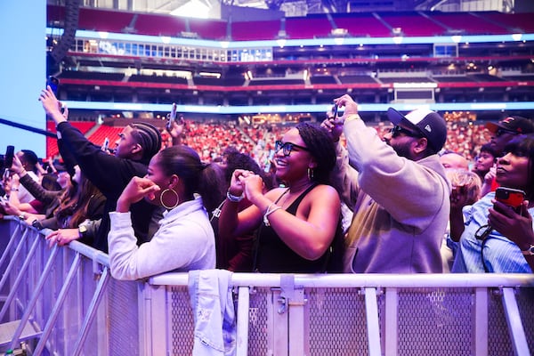 Fans cheer as Ludacris performs during the Delta bash, bringing the airline's centennial year to a close. (Abbey Cutrer/AJC)