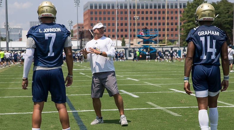 Georgia Tech offensive coordinator Dave Patenaude (center) interacts with players. (Alyssa Pointer/alyssa.pointer@ajc.com)
