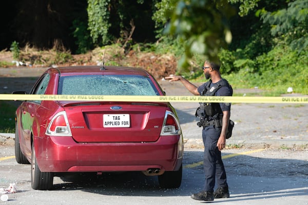 A red Ford Fusion was part of the investigation Monday. (Ben Hendren for the AJC)