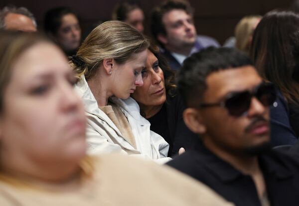 Survivors and family members of those killed react as Judge Victoria Rossetti sentences Robert Crimo III at the Lake County Courthouse, in Waukegan, Ill., on Thursday, April 24, 2025. (Stacey Wescott/Chicago Tribune via AP, Pool)