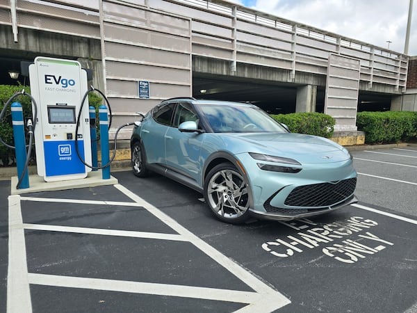 A 2024 Genesis GV70 parked at a charging station in East Cobb. (Chris Hardesty/Cox Automotive)