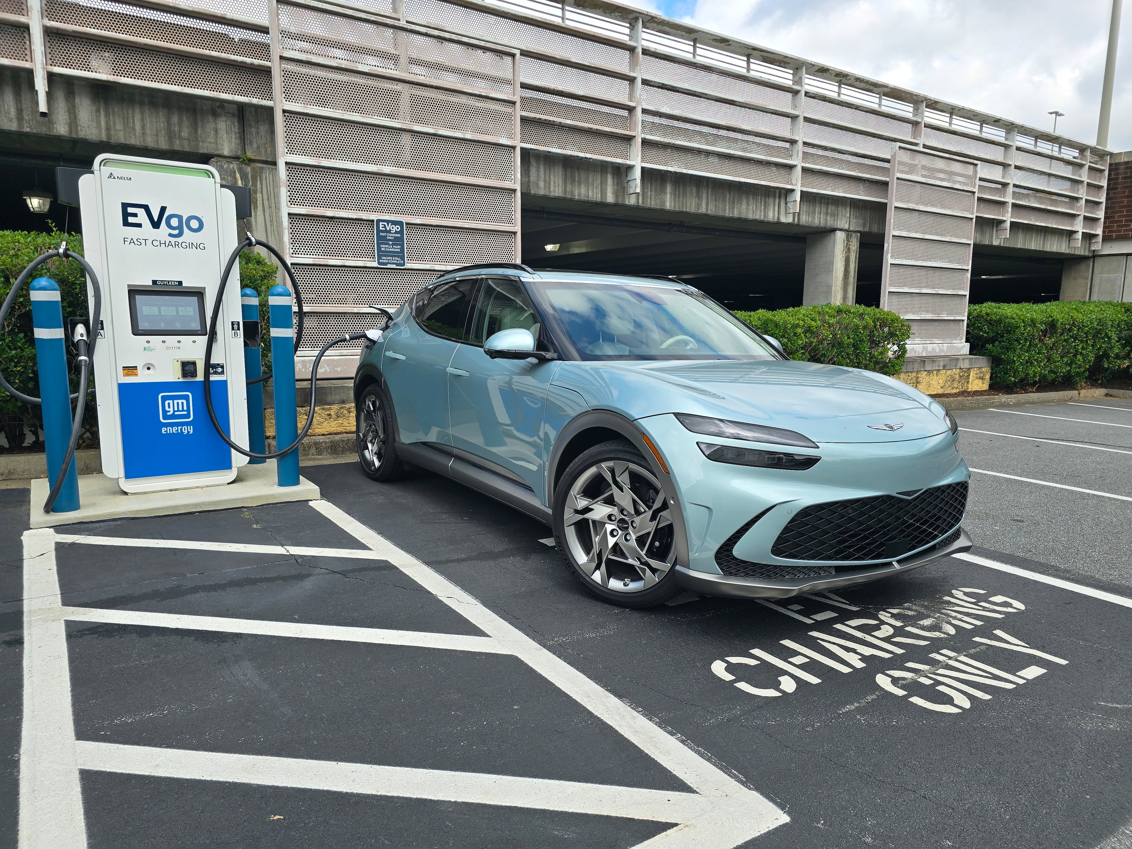 A 2024 Genesis GV70 parked at a charging station in East Cobb. (Chris Hardesty/Cox Automotive)