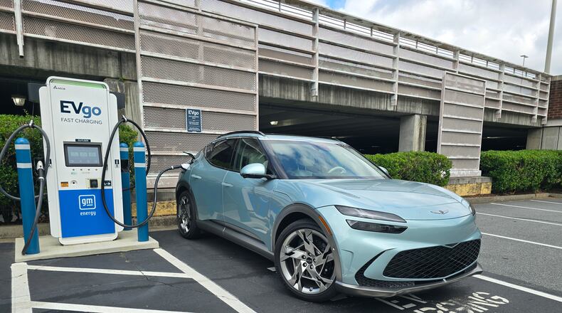 A 2024 Genesis GV70 at a charging station in a retailer's parking lot in East Cobb, Georgia. Photo courtesy of Chris Hardesty of Cox Automotive.