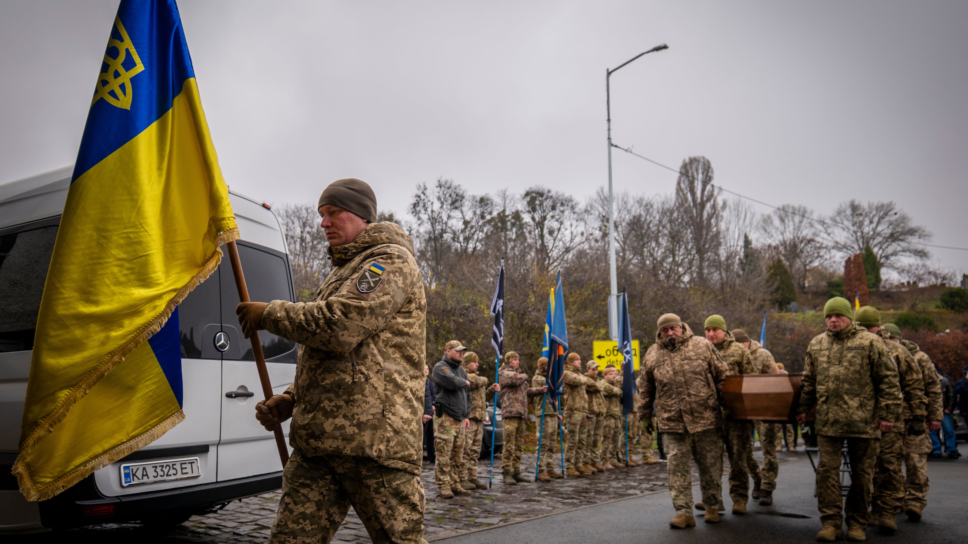 Servicemen carry the coffin of volunteer soldier Yukhym Agafontsev, 22, killed in a battle with the Russian troops, during a farewell ceremony in Kyiv, Ukraine, Tuesday, Dec. 2, 2025. (AP Photo/Dan Bashakov)