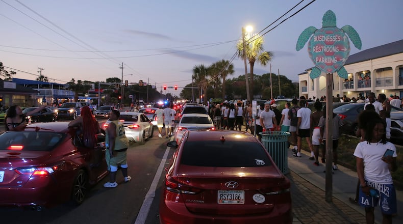 FILE: Party-goers hang out in the street during stand-still traffic caused by Orange Crush in April this year.