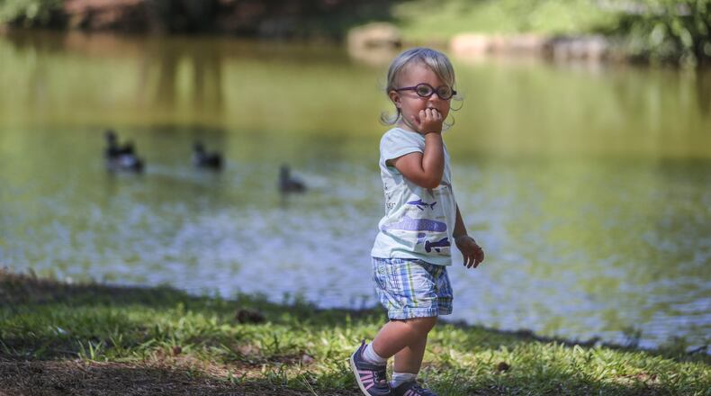 A child plays near a North Georgia lake in June 2017. JOHN SPINK/JSPINK@AJC.COM.