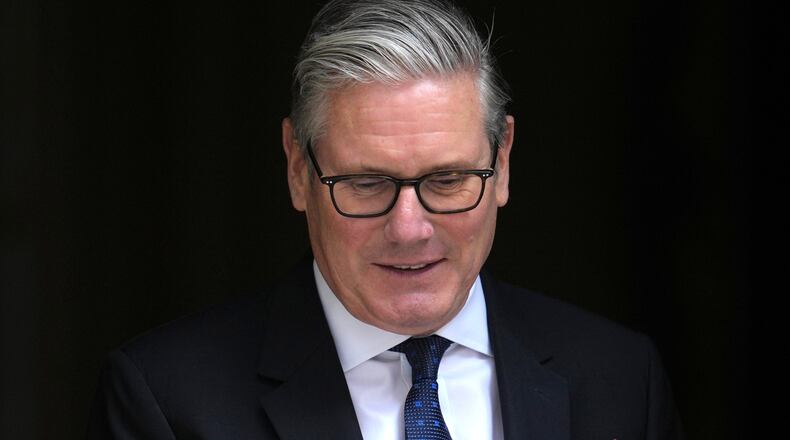 Britain's Prime Minister Keir Starmer leaves 10 Downing Street to attend the weekly session of Prime Minister's Questions in parliament in London, Wednesday, June 10, 2026. (AP Photo/Kin Cheung)