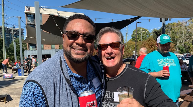 The 92.9/The Game afternoon show Carl Dukes and Mike Bell at New Realm Brewery October 22, 2022 to celebrate the station's 10th anniversary. RODNEY HO/rho@ajc.com