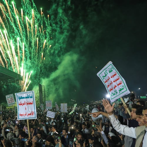Fireworks burst as Houthi supporters rally against the Saudi-led coalition in Sanaa, Yemen, Monday, July 20, 2026. Placards in Arabic read: "God is great, Death to America, Death to Israel, A curse on the Jews and Victory to Islam" and "boycott American and Israeli goods". (AP Photo/Osamah Abdulrahman)