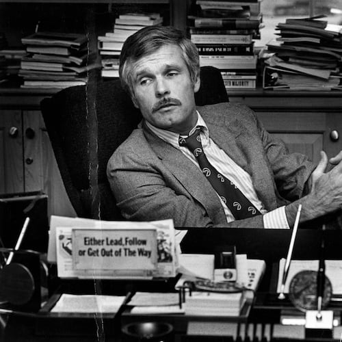 Ted Turner is seen at his desk inside the CNN Center in 1982. (Nancy Mangiafico/AJC)