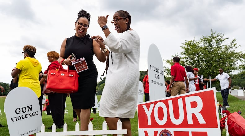 Delta Sigma Theta Stone Mountain-Lithonia Alumnae Chapter president Candace Hull-Simon, left, speaks with member Latise Egeston after a voter mobilization event at New Birth Missionary Baptist Church in Stonecrest, GA on Saturday, July 20, 2024. (Seeger Gray / AJC)