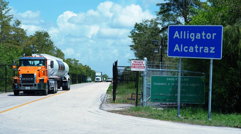 FILE - Trucks come and go from the "Alligator Alcatraz" immigration detention center in the Florida Everglades, Aug. 28, 2025, in Collier County, Fla. (AP Photo/Rebecca Blackwell, File)