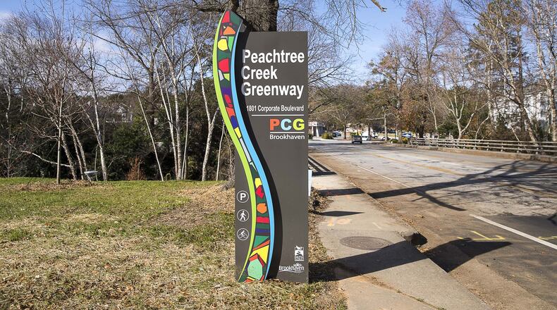 12/12/2019 — Brookhaven, Georgia — A decorative sign welcomes community members to the newly developed Peachtree Creek Greenway, Thursday, December 12, 2019. (ALYSSA POINTER/ALYSSA.POINTER@AJC.COM)