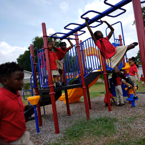 FILE - Students from Thomas Leadership Academy play on the school's playground in Eatonville, Fla., on Aug. 23, 2023. (AP Photo/Rebecca Blackwell, File)