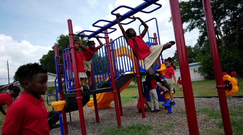FILE - Students from Thomas Leadership Academy play on the school's playground in Eatonville, Fla., on Aug. 23, 2023. (AP Photo/Rebecca Blackwell, File)