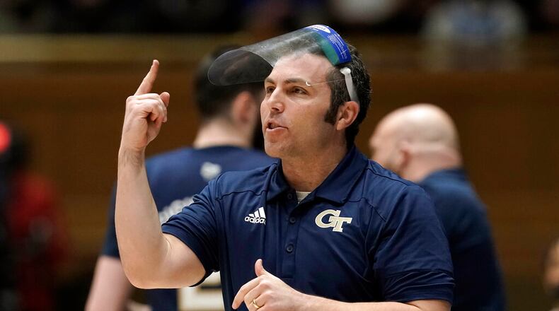 Georgia Tech head coach Josh Pastner directs his team during the first half of an NCAA college basketball game against Duke in Durham, N.C., Tuesday, Jan. 4, 2022. (AP Photo/Gerry Broome)