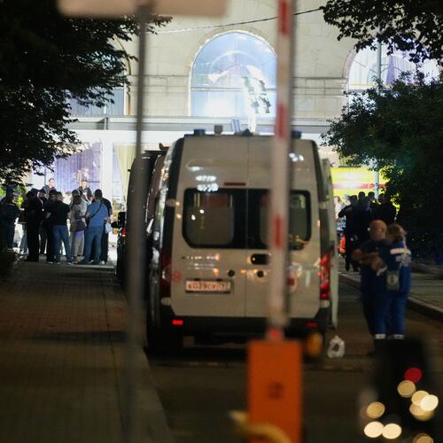 Ambulances and special services vehicles are parked near the site where an improvised explosive device detonated at a restaurant in central Moscow, Saturday, Aug. 1, 2026. (AP Photo/Pavel Bednyakov)