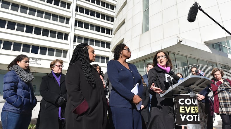 Lauren Groh-Wargo speaks to members of the press outside the Richard B. Russell Building in Atlanta as Fair Fight Action filed a federal voting rights lawsuit in November 2018. HYOSUB SHIN / HSHIN@AJC.COM