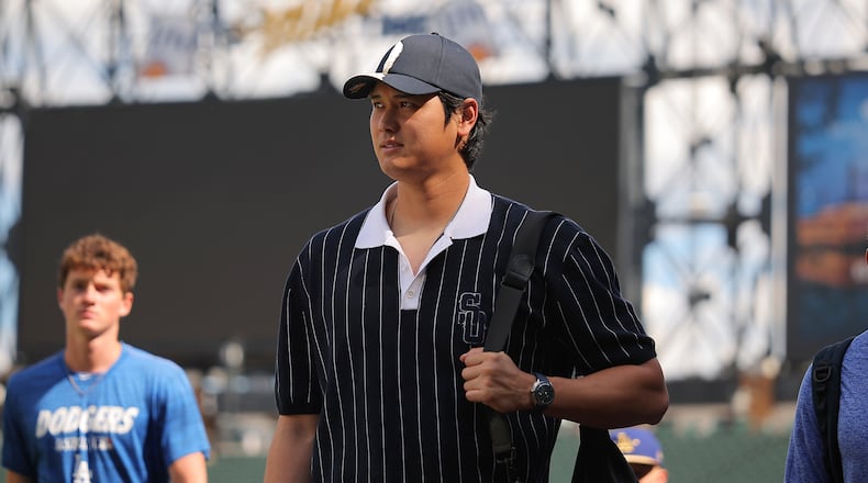 Los Angeles Dodgers' Shohei Ohtani enters the field prior to a baseball game against the Chicago White Sox, Friday, June 12, 2026, in Chicago. (AP Photo/Melissa Tamez)