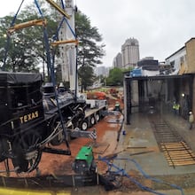 The Texas is lifted by a 110-ton crane to its new home at the Atlanta History Center Thursday after a trip to North Carolina for refurbishing. Famed for its role along with the locomotive the General in the Civil War’s Great Locomotive Chase in 1862, the Texas will be permanently displayed in a glass-walled enclosure that will be illuminated at night and clearly visible from West Paces Ferry Road at all hours. BOB ANDRES / BANDRES@AJC.COM