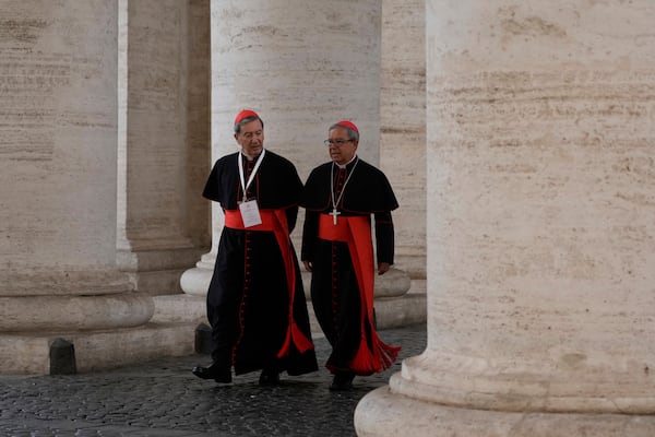 Cardinals Ruben Salazar Gomez, left is flanked by Cardinal Luis José Rueda Aparicio as they arrive in the New Hall of the Synod at the Vatican, Tuesday, May 6, 2025, the last time before the start of the conclave starting in the afternoon of Wenesday, May 7, when they will elect the successor of Pope Francis. (AP Photo/Gregorio Borgia)