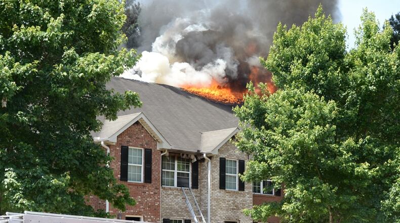 A fire occurred Tues., May 31, 2016, in the 3700 block of Travis Trace near Holcombe Road, which is off Redan Road. KENT D. JOHNSON / KDJOHNSON@AJC.COM